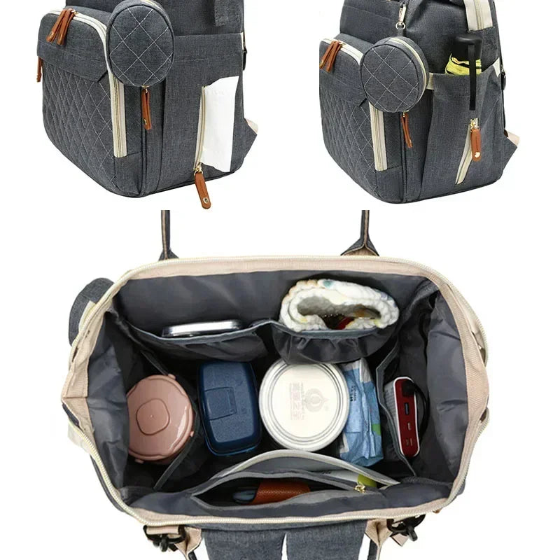 Sac à Dos à Langer pour bébé, Sac de Voyage avec Lit de Bébé Portable, 35L Grande Capacité Sac de Maternité, Sac à Couches Multifonction avec 2 Sangles de Poussette et Berceau