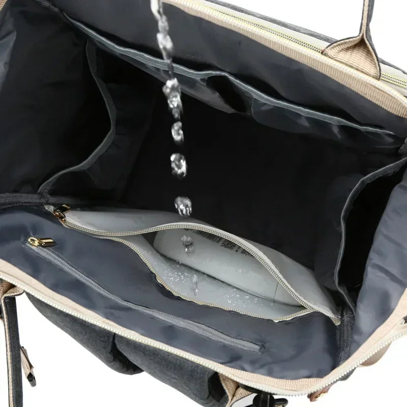 Sac à Dos à Langer pour bébé, Sac de Voyage avec Lit de Bébé Portable, 35L Grande Capacité Sac de Maternité, Sac à Couches Multifonction avec 2 Sangles de Poussette et Berceau