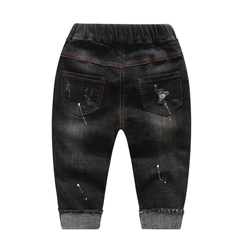 Jeans en denim extensible pour bébés garçons.